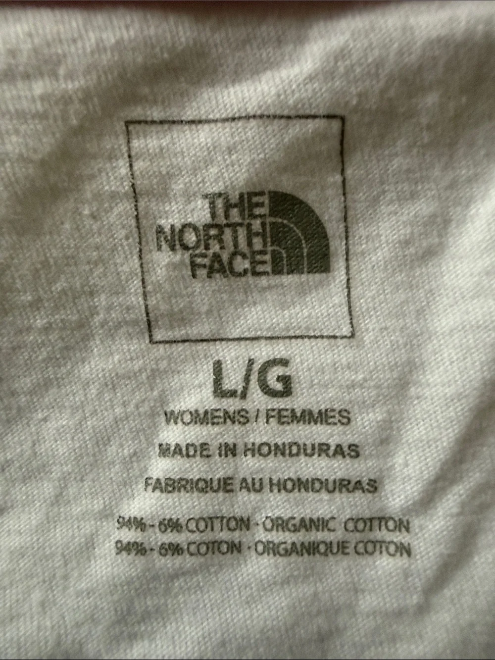 The North Face Women's White V-Neck Logo Tee with Pink, Orange and Blue Graphic - Picture 4 of 4
